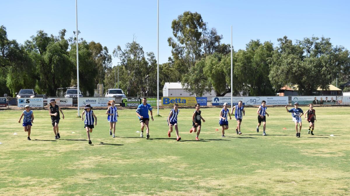 Roos bring bounce to footy clinic | Shepparton News