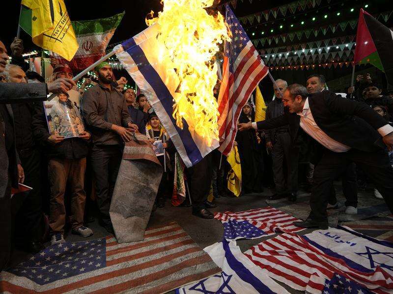 Iran warns against US strike, hints at executions