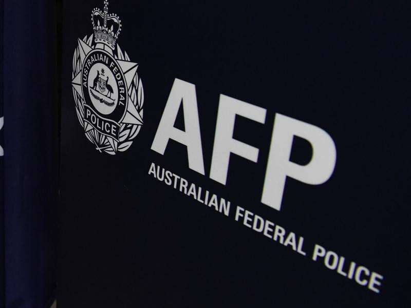 AFP bans use of controversial spit hoods after review | Shepparton News