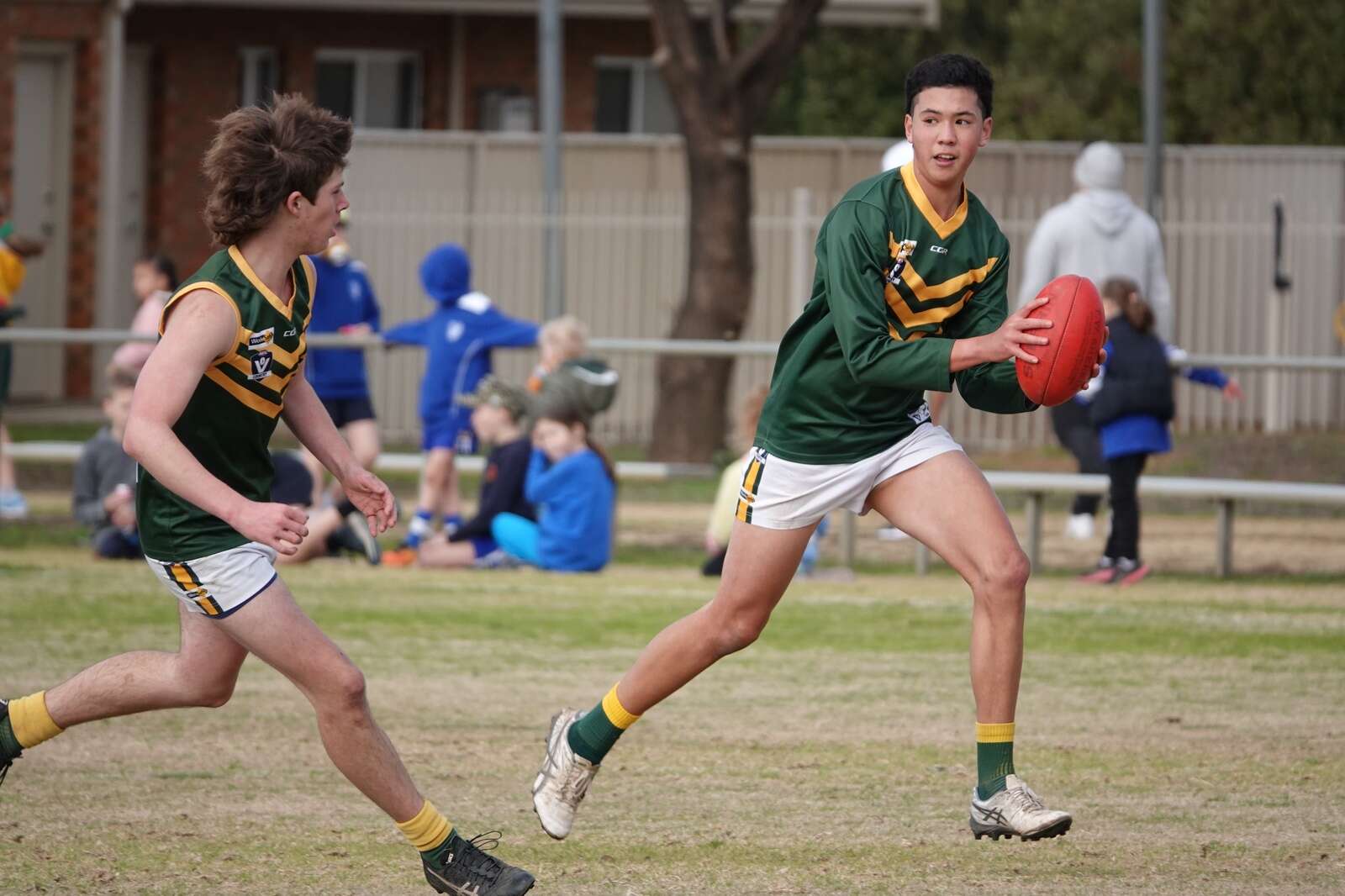 Cobram and Strathy each climbing up ladder Cobram Courier