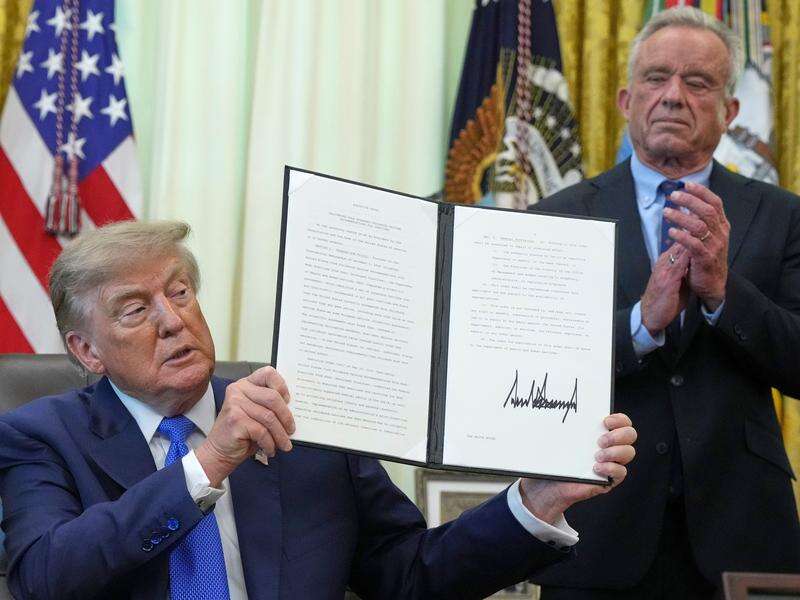 Trump signs order to reduce US vaccine schedule