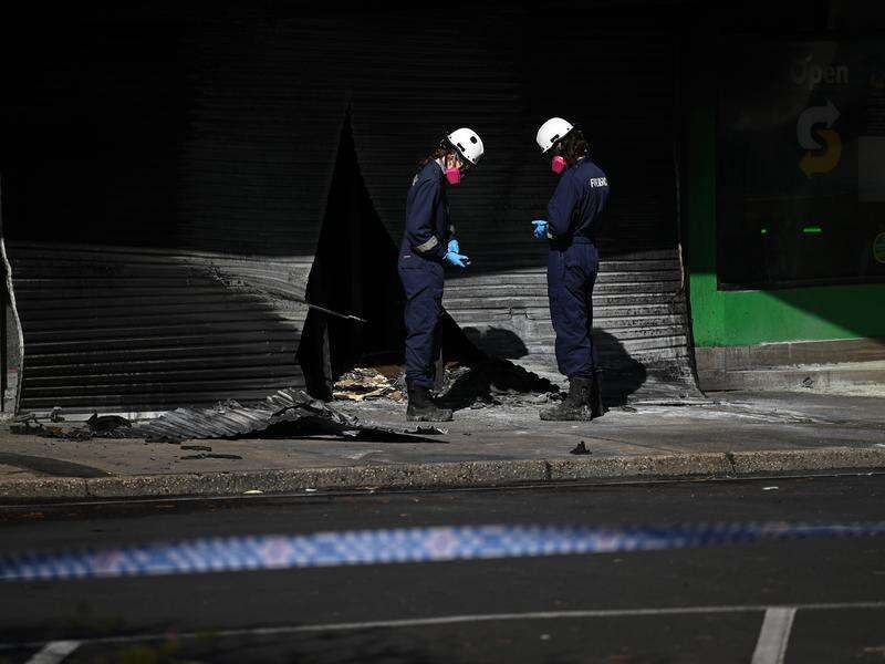 Manhunt as tobacco shop arsonist 'left for dead'