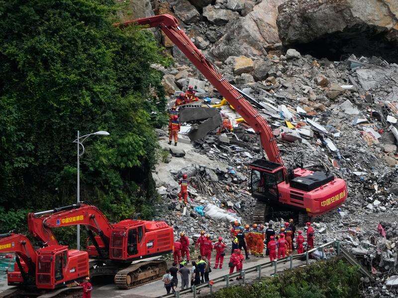 Searching the rubble for survivors of China landslide