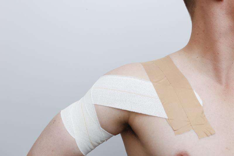 Taping to protect a shoulder after a dislocation Riverine Herald