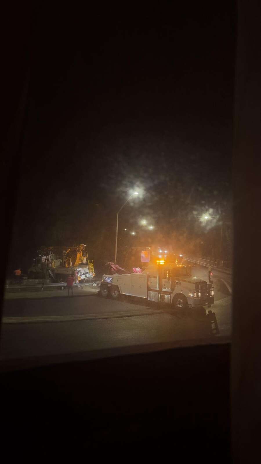 Truck crashes through bridge rail