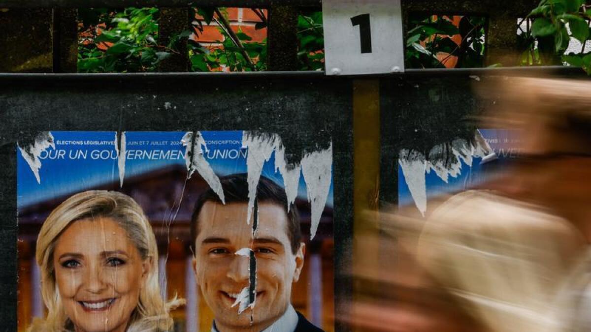 Posters for Marine Le Pen and Rassemblement National's Jordan Bardella