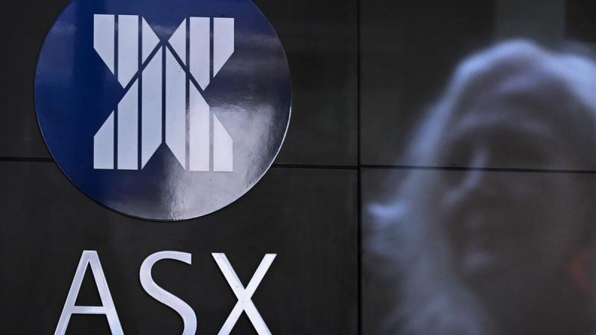 Woman reflected in the ASX building in Sydney