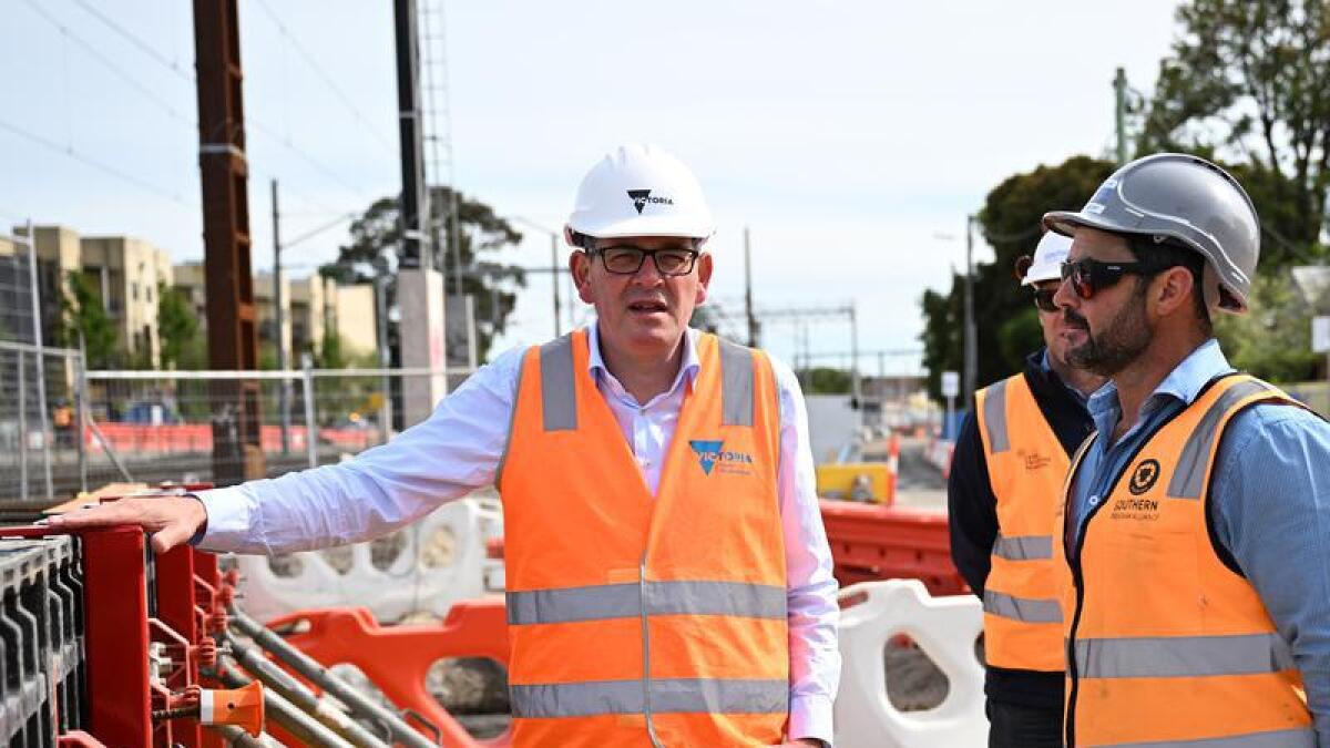 Daniel Andrews with construction workers