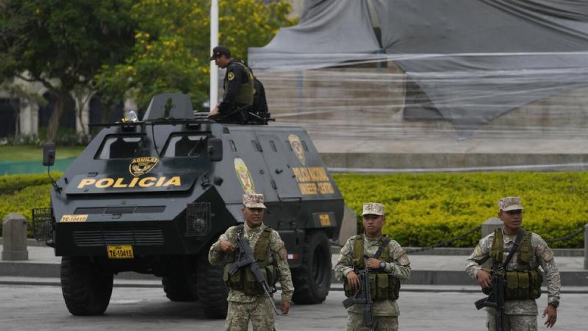 Soldiers and National Police guard San Martin Plaza