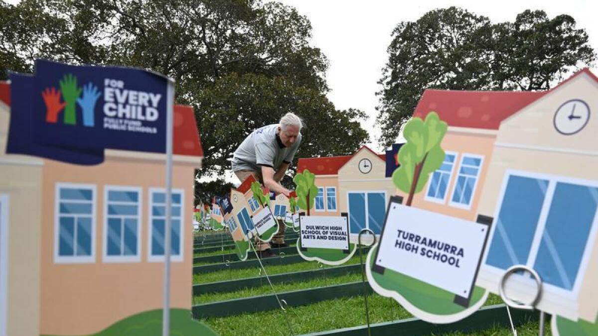 Cut-out school buildings at a For Every Child event in Sydney