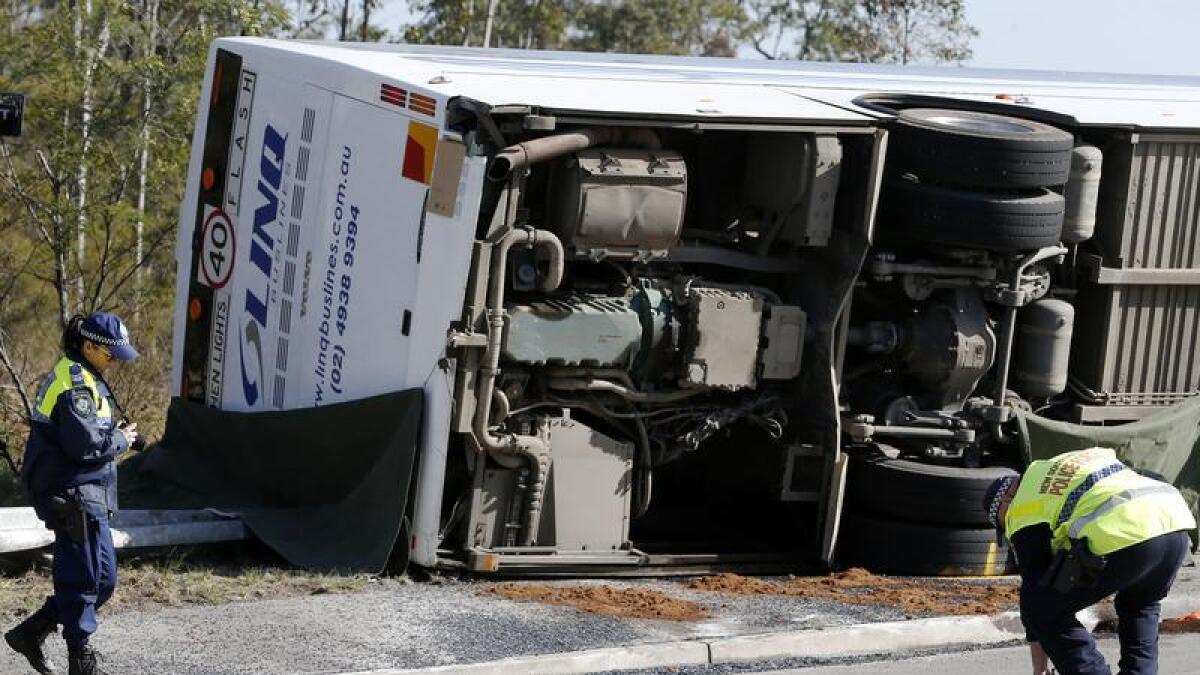 Investigators at the scene of a bus crash in the NSW Hunter Valley