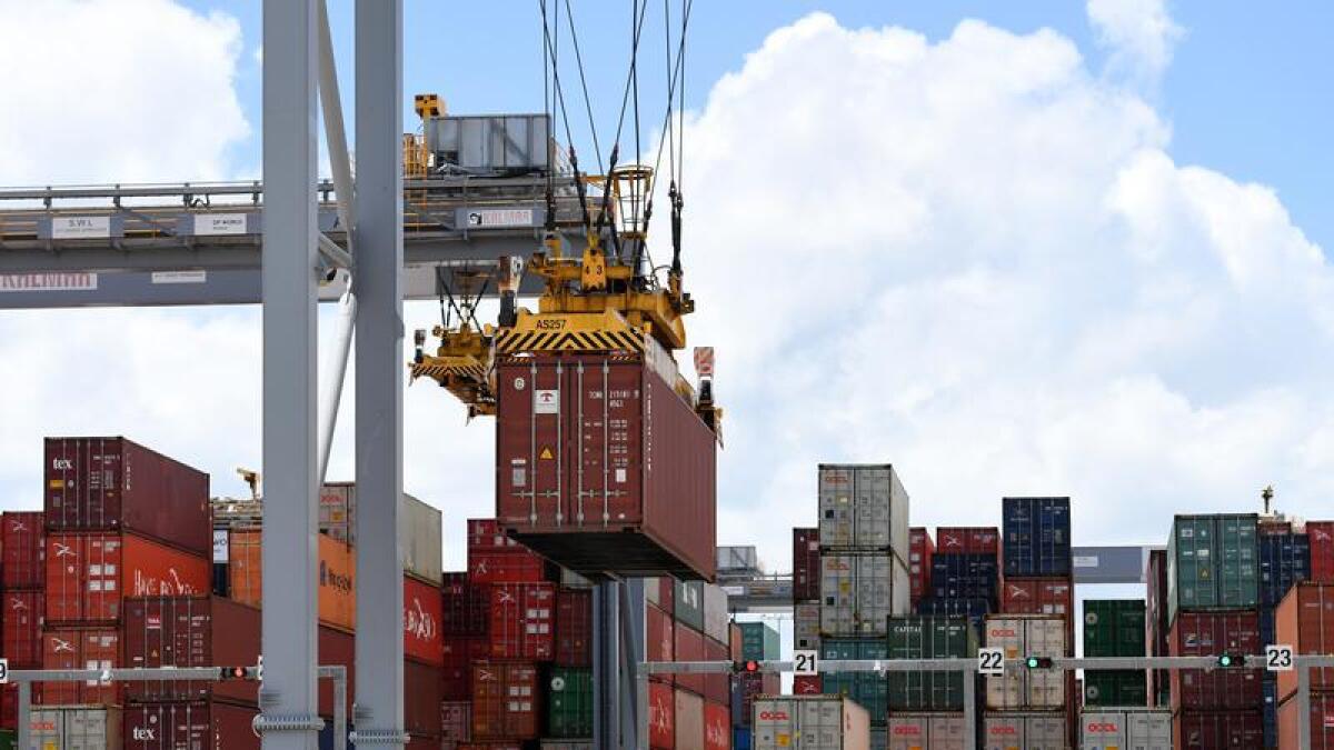 Shipping containers are handled at the Port of Brisbane (file image)
