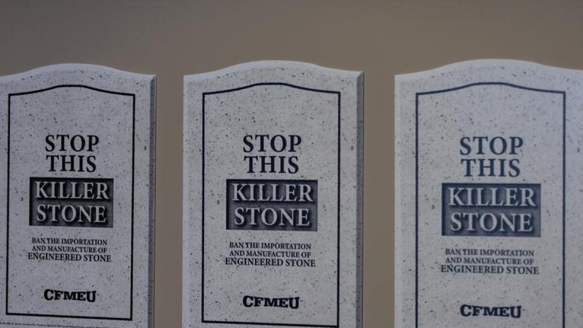 “Stop This Killer Stone” signs at a CFMEU media conference
