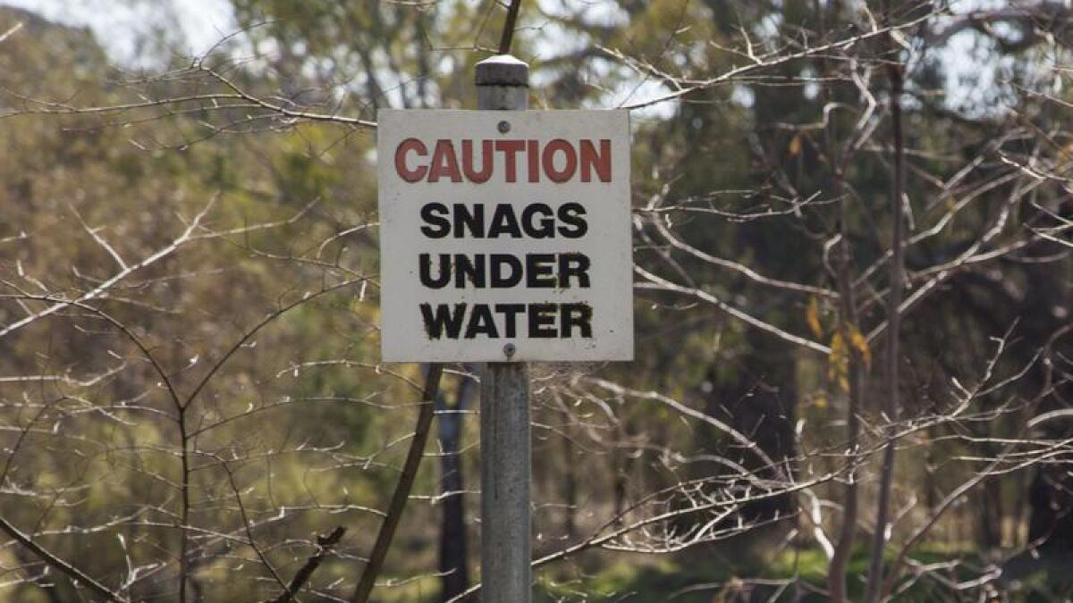 Warning sign near river