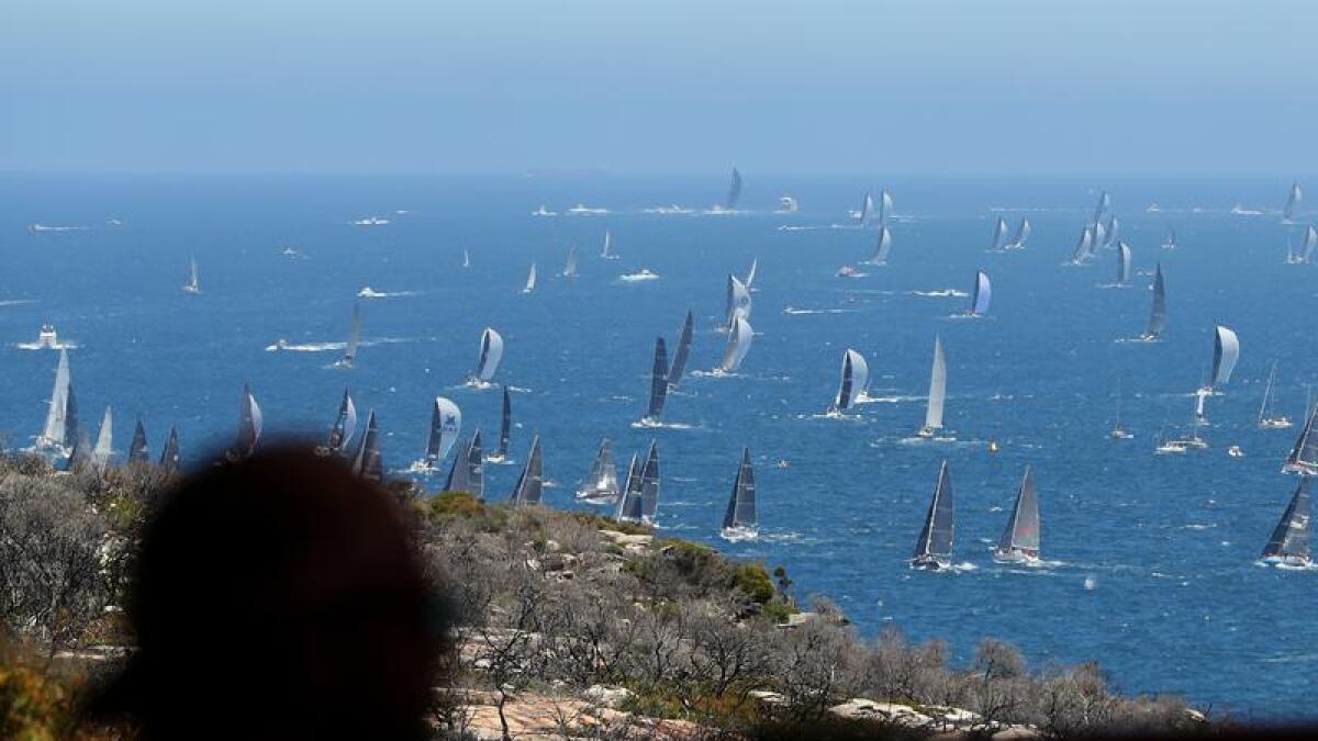 Yachts sail pass North Head for the Sydney to Hobart race.