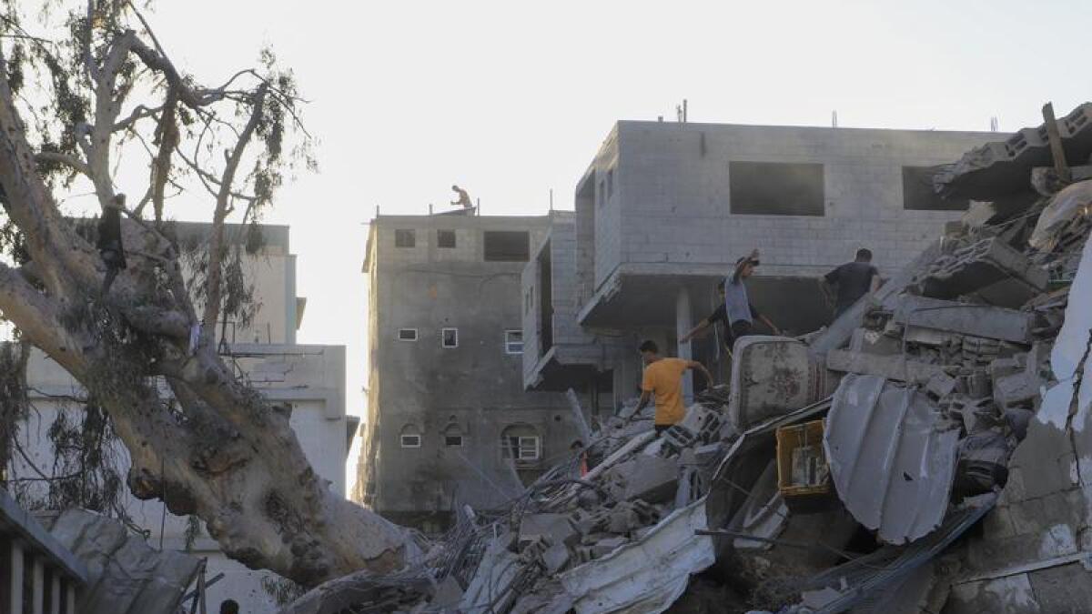 Buildings destroyed in an Israeli air strike in Gaza