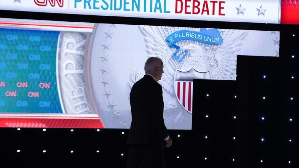 President Joe Biden walks from the debate stage