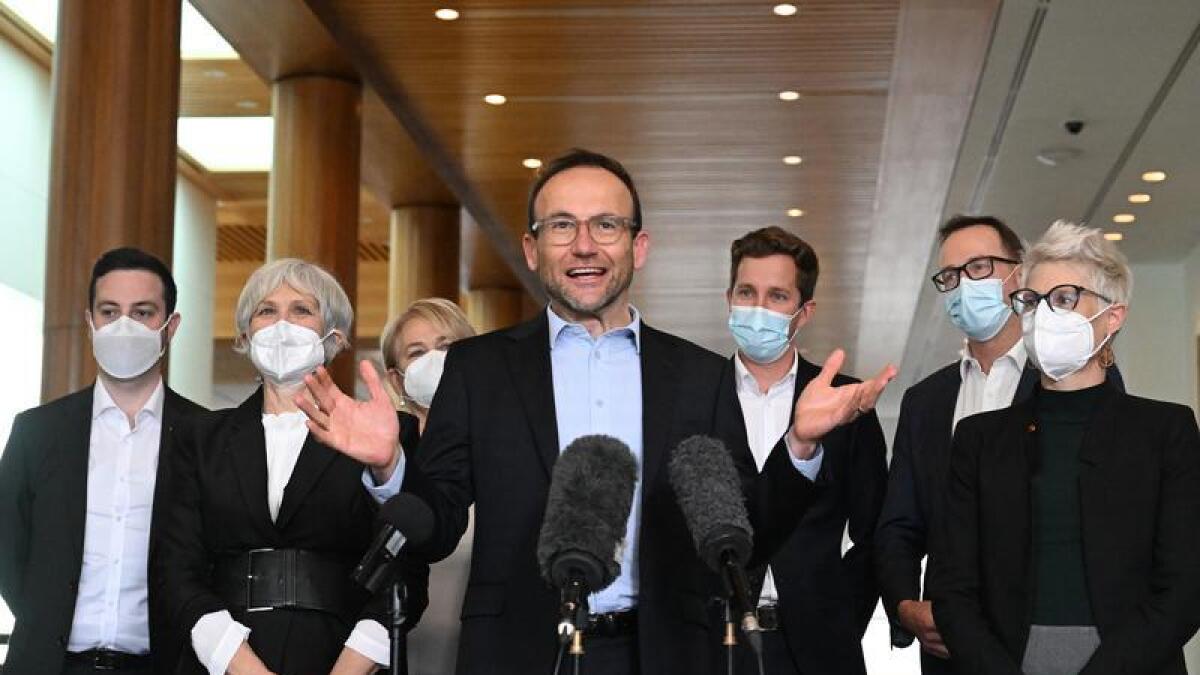 Greens leader Adam Bandt at a press conference with other party MPs