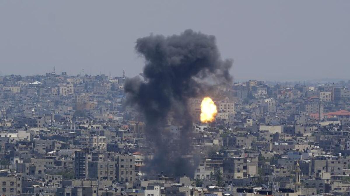 Smoke and fire from an  Israeli air strike on Gaza City.