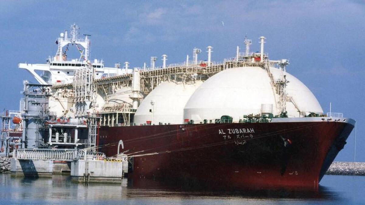 A Qatari liquid natural gas tanker ship being loaded up with LNG