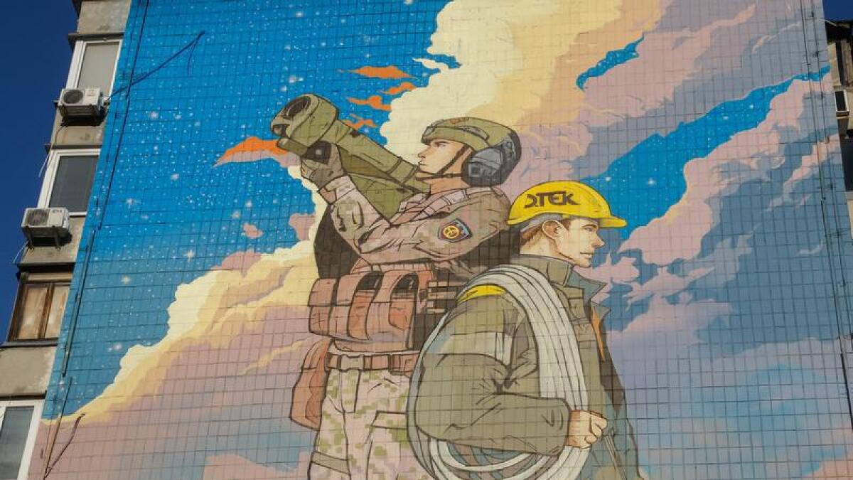 Kyiv mural showing Ukrainian air defence forces and energy workers