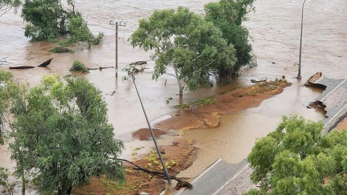Floodwaters over the highway in the Kimberley region, WA 
