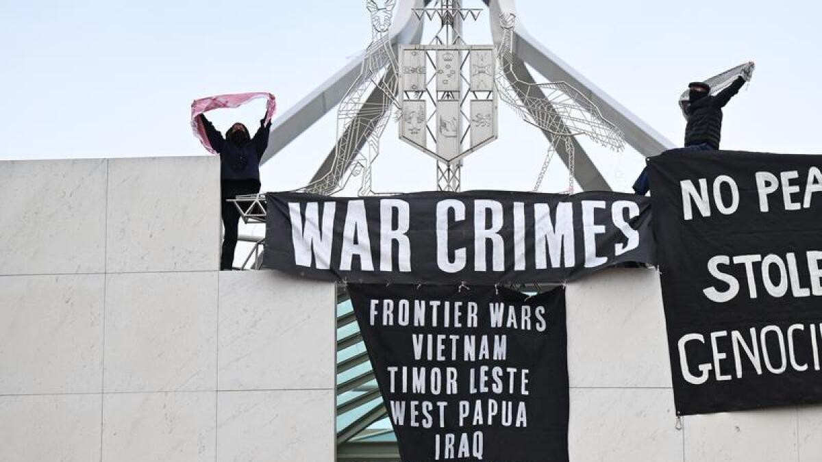 Pro-Palestine banners hanging from Parliament House
