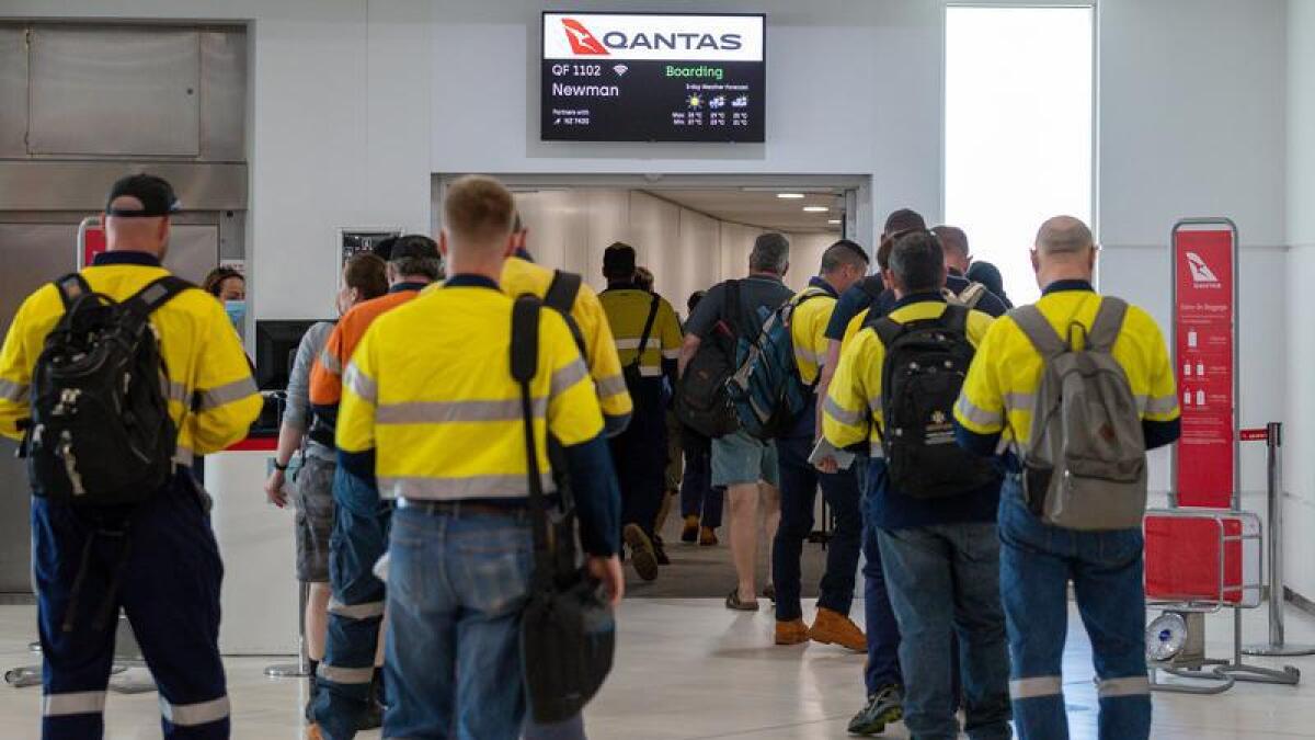 FIFO mine workers board a Qantas flight (file image)