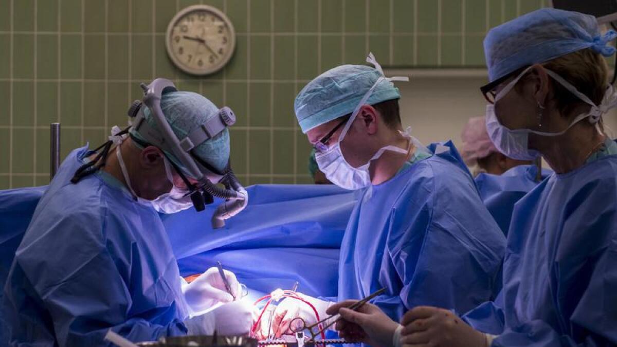 Cardiac surgeons undertake an operation.