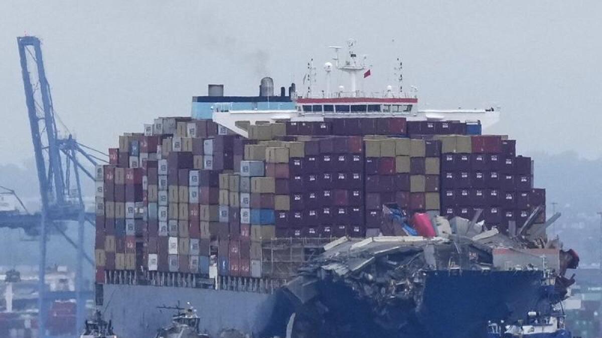 Crews work to move the cargo ship Dali in Baltimore, Monday