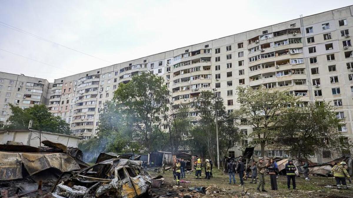 Rescuers work at the site of a shelling in Kharkiv