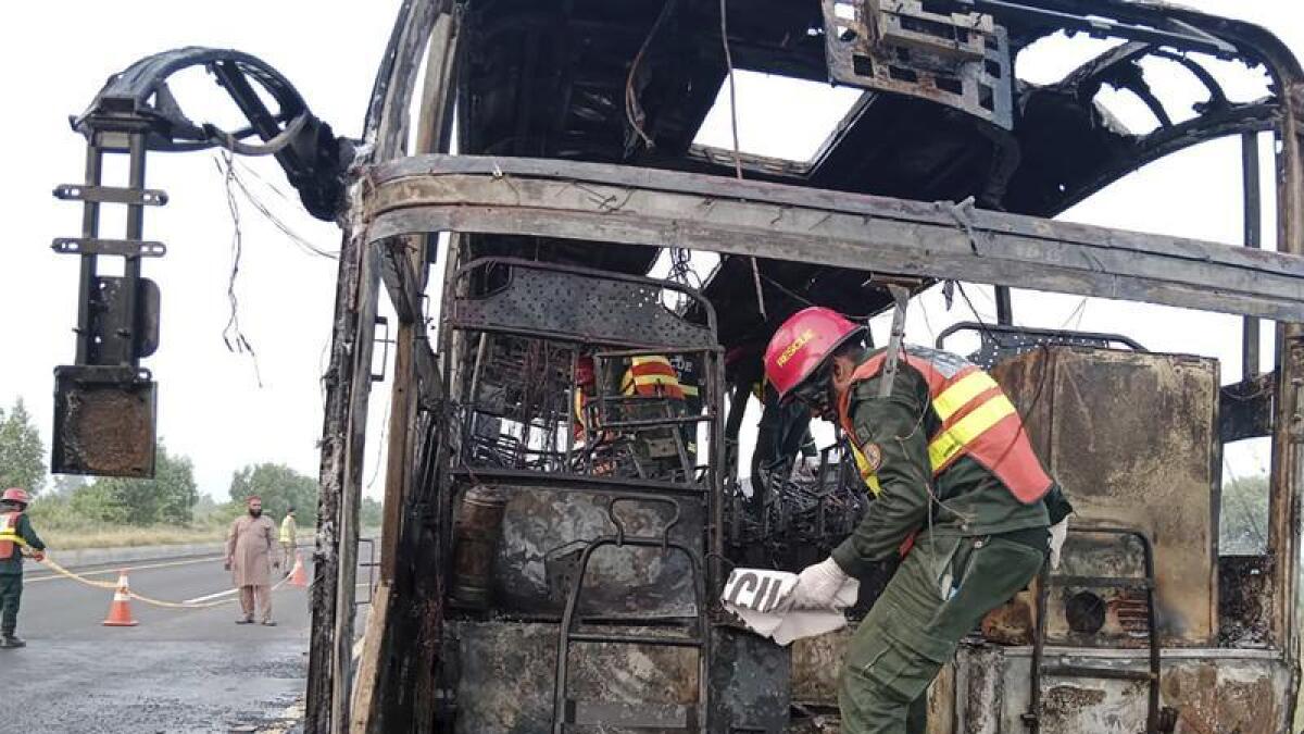 The burnt out remains of a bus that crashed in Pakistan