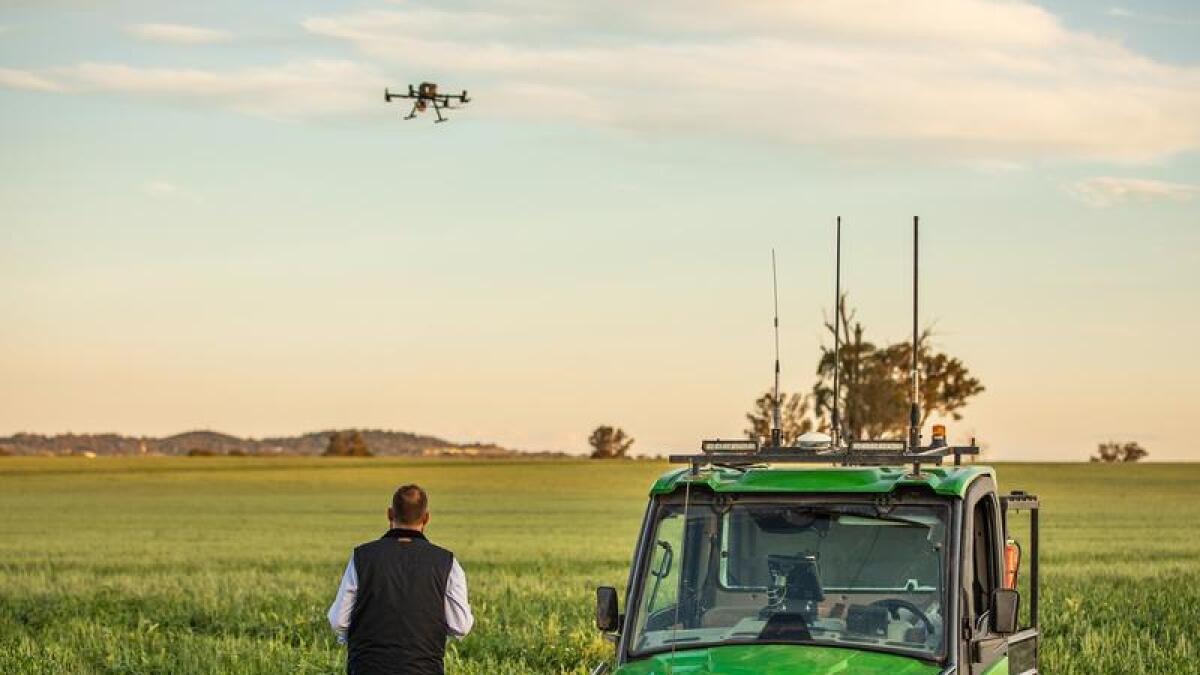 A researcher using a drone at university farm in Wagga Wagga.