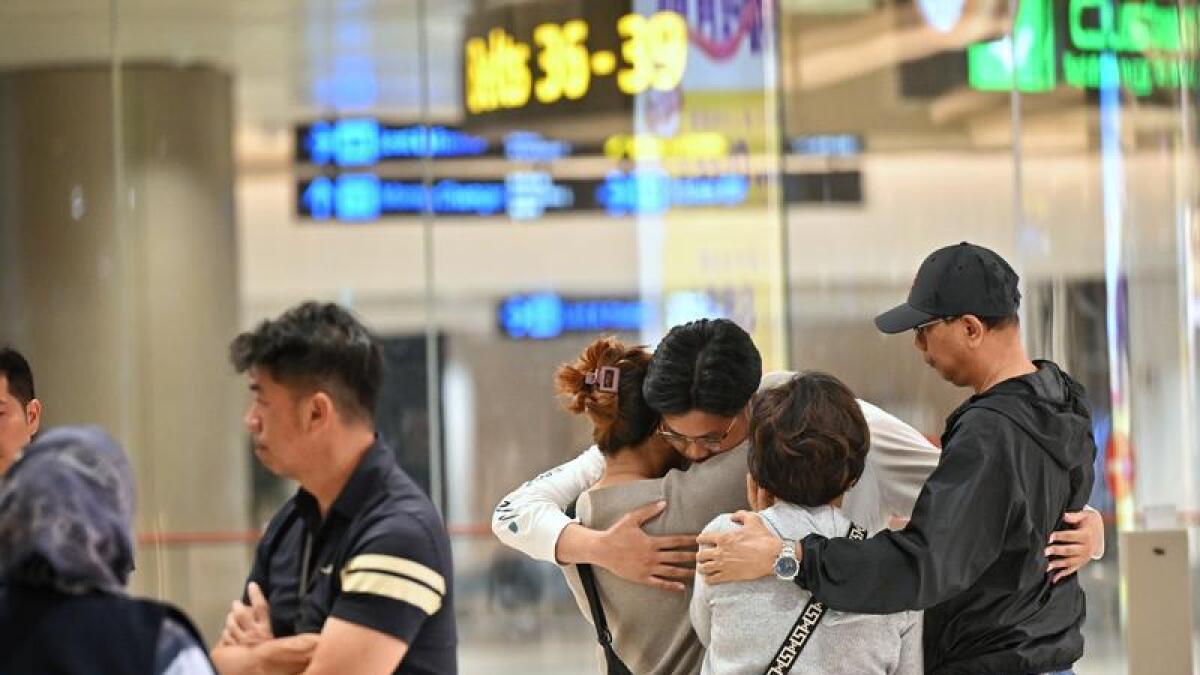 Relieved passengers from the Singapore Airlines flight