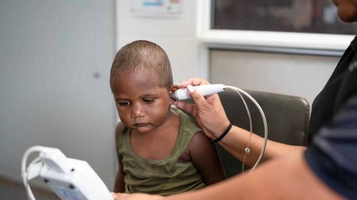 A child gets a hearing test.