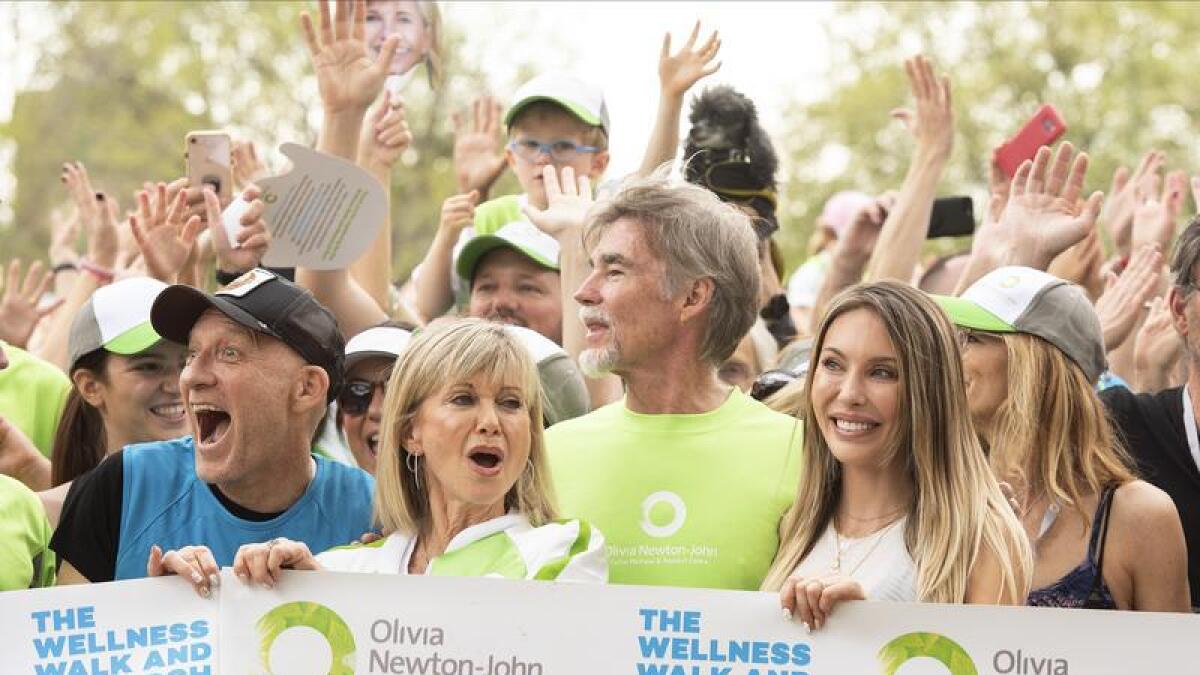 A file photo of Olivia Newton-John, family and supporters
