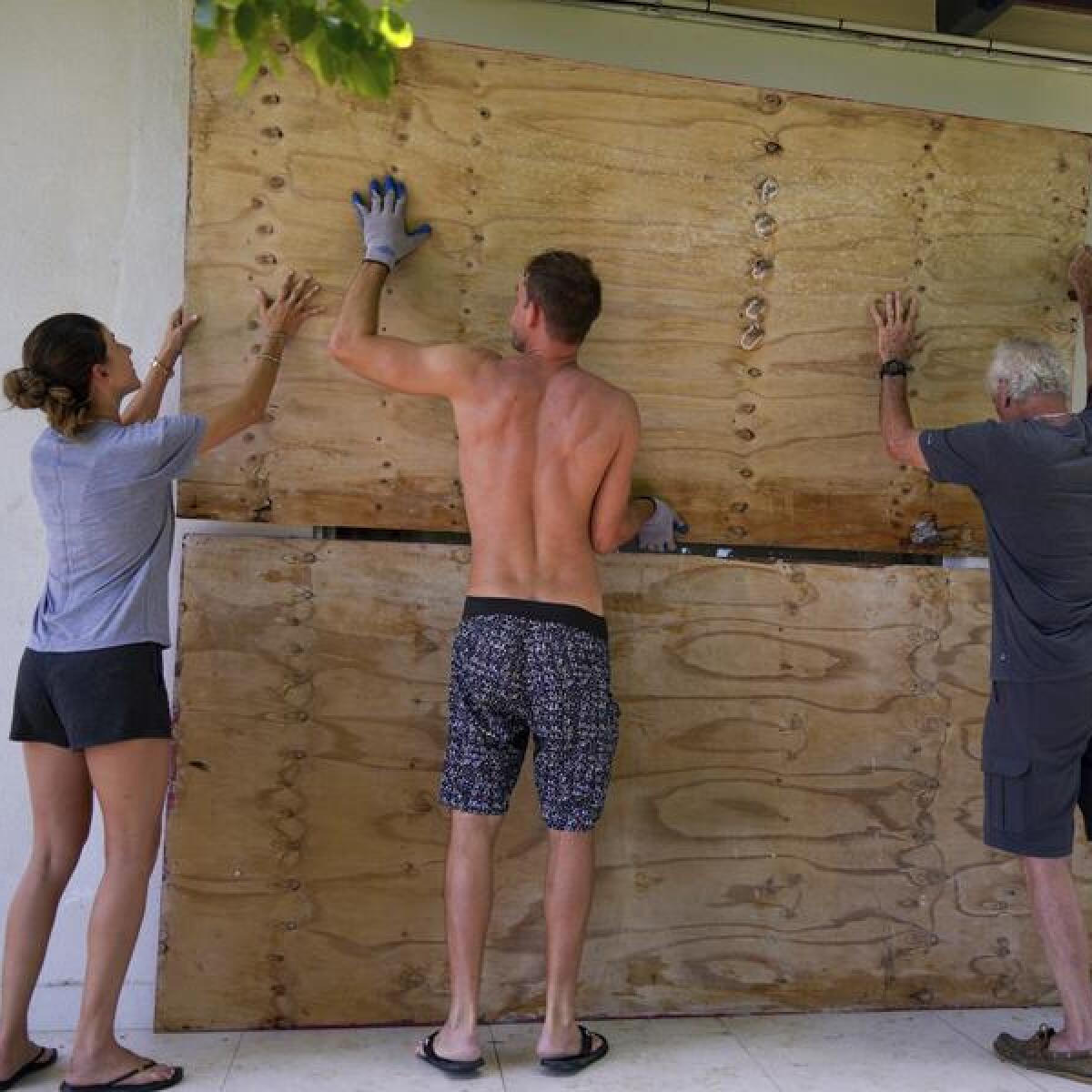 Residents preparing their home for a storm