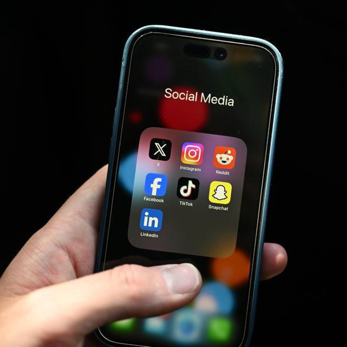 Social media apps seen on a smartphone (file image)