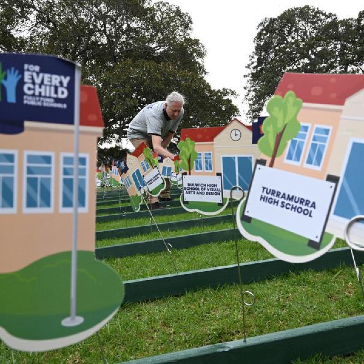 Cut-out school buildings at a For Every Child event in Sydney