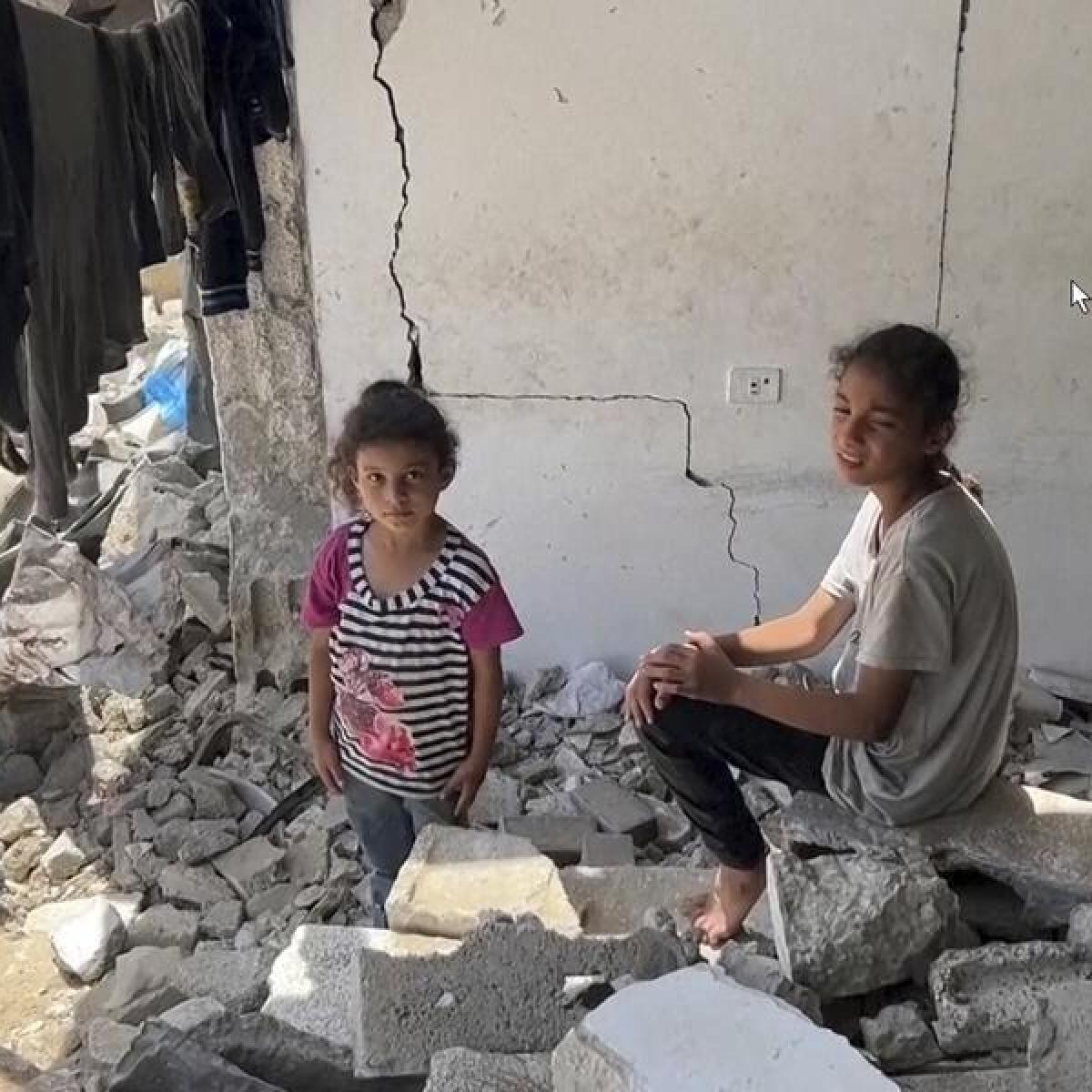 Children in a bombed out building