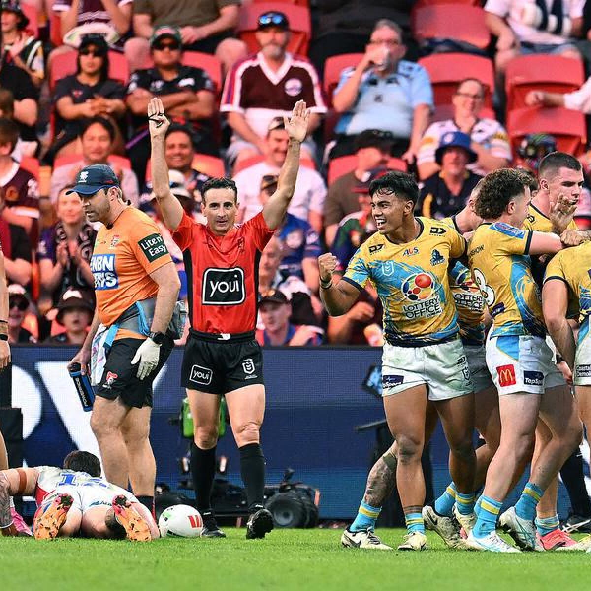 Titans players celebrating a try before it was overturned.