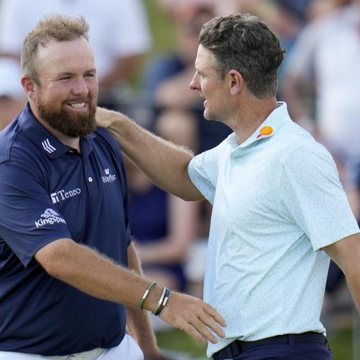 Shane Lowry (L) and Justin Rose