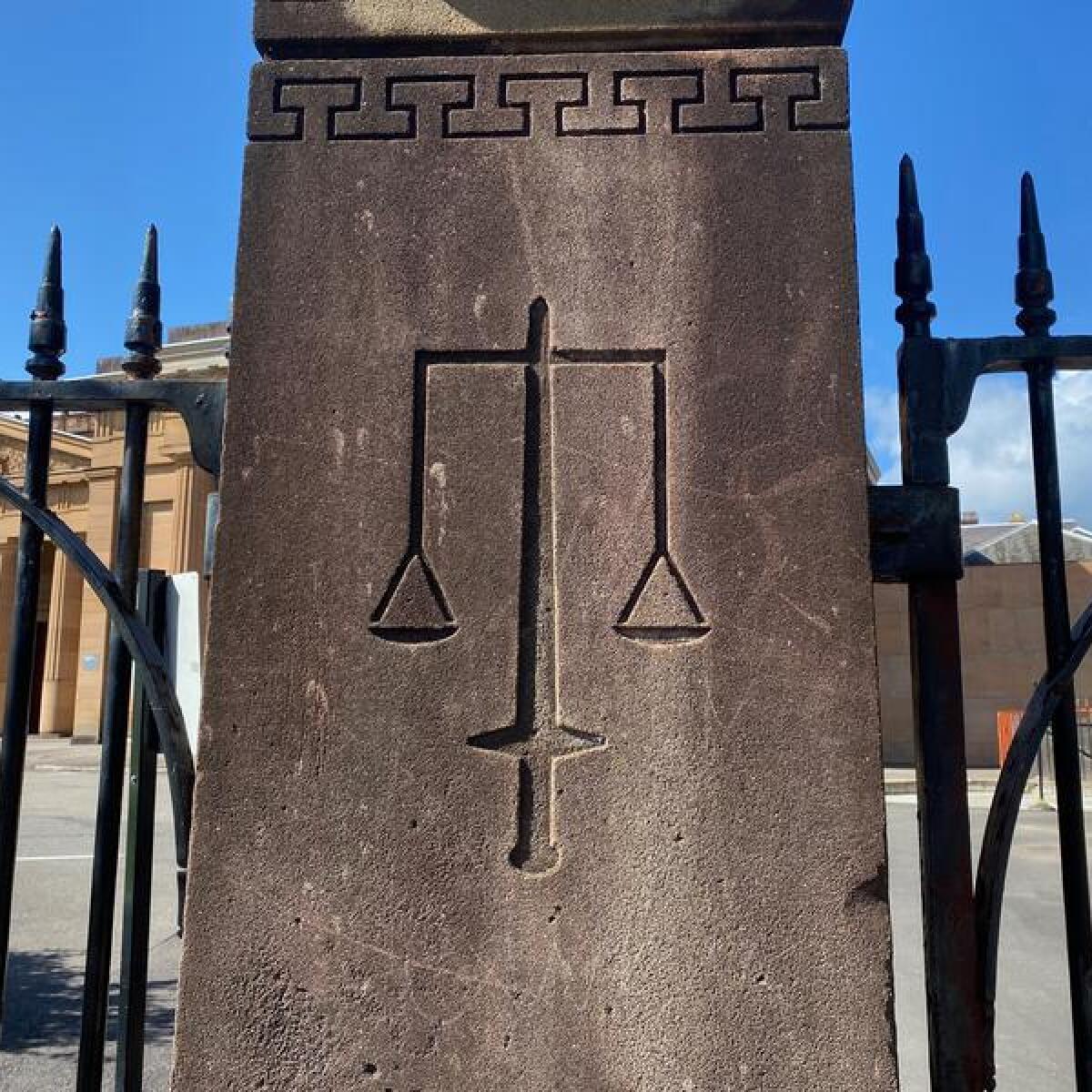 The scales of justice engraved on a pillar (file image)