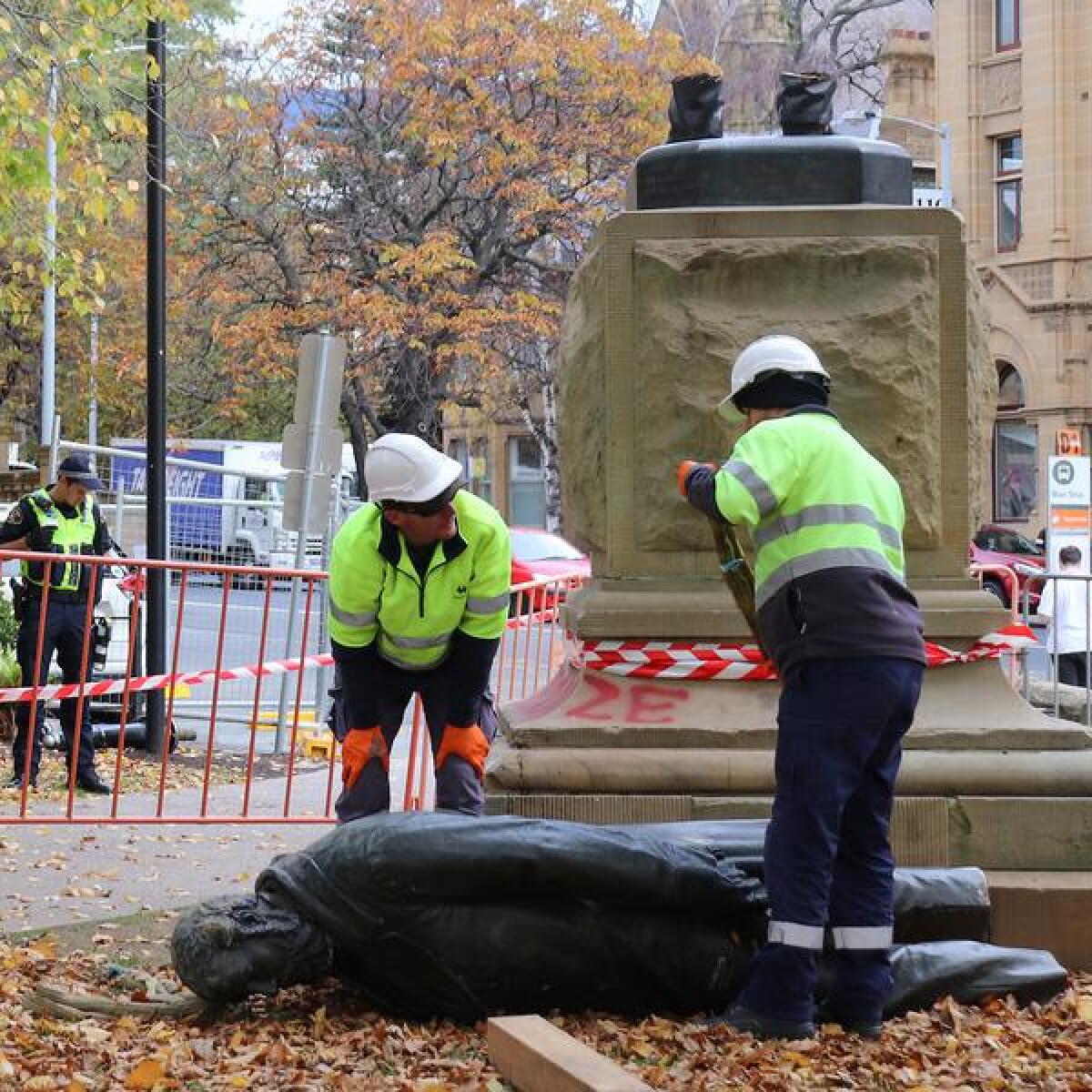 Council workers remove the statue on Wednesday.