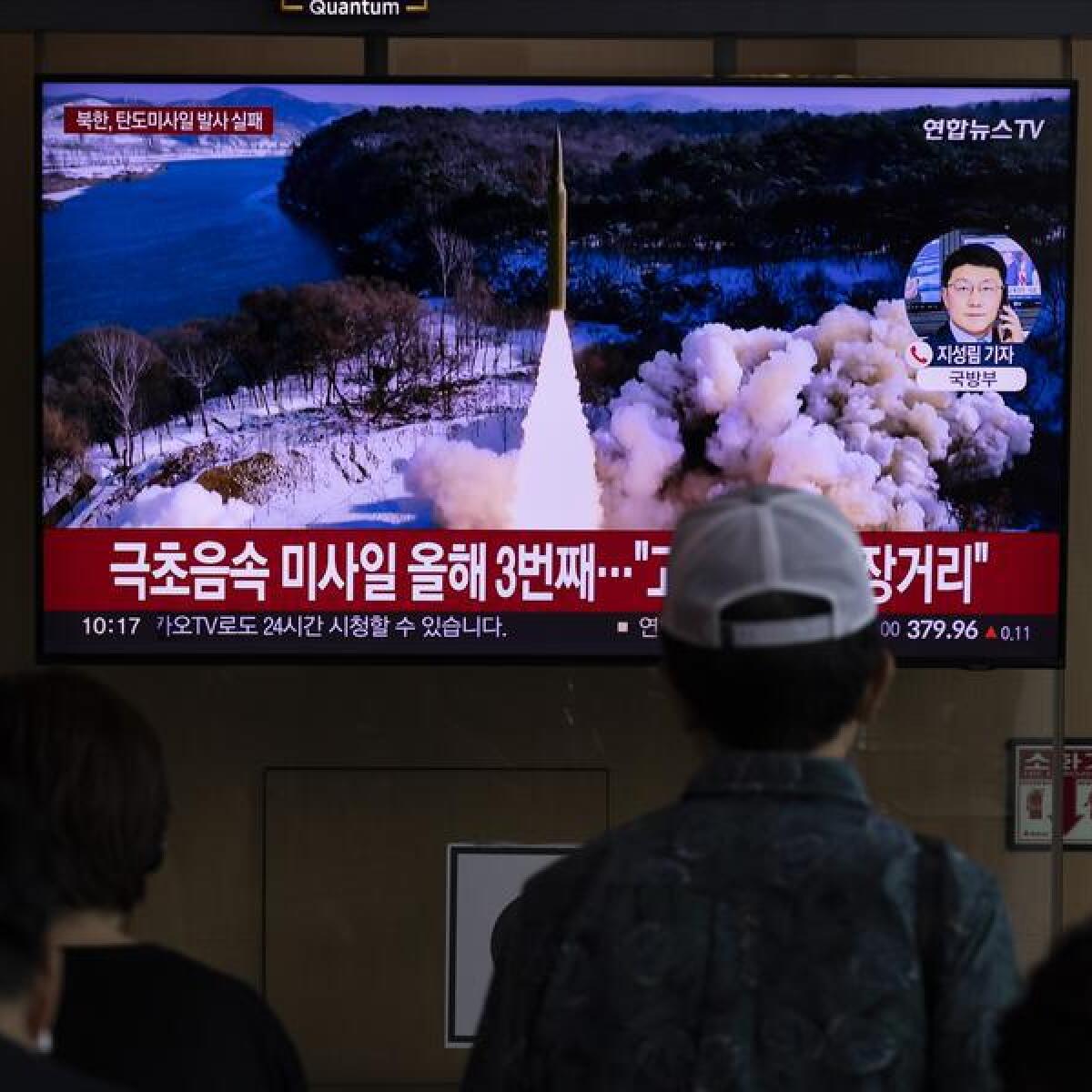 People watch the news at a station in Seoul, South Korea