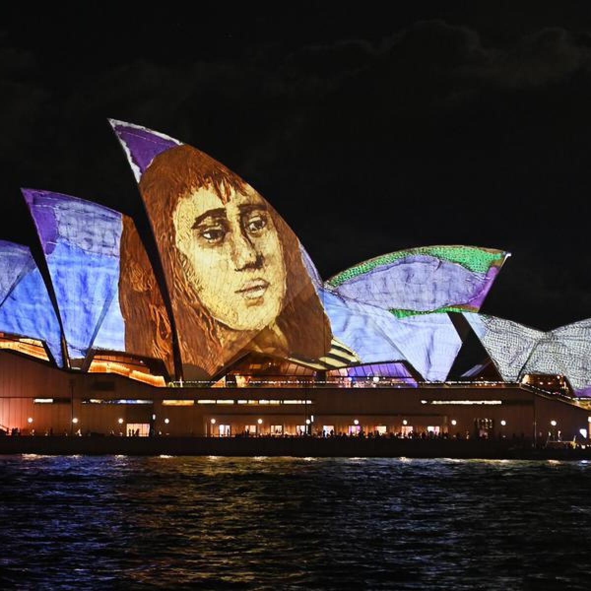 Sails of the Sydney Opera House illuminated with projections for Vivid