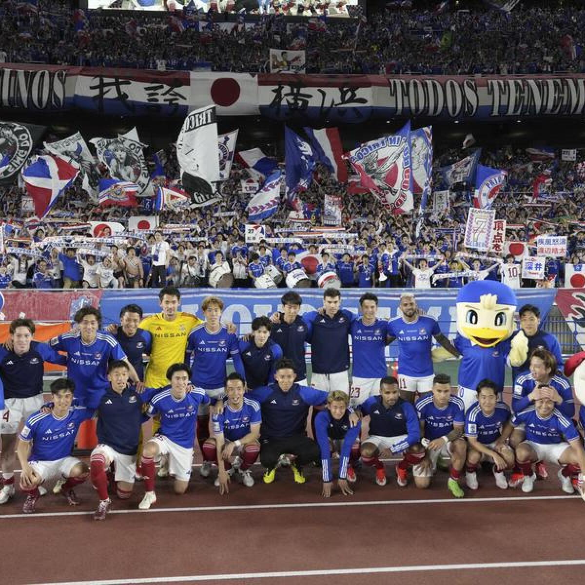 Celebrating Yokohama F. Marinos players.