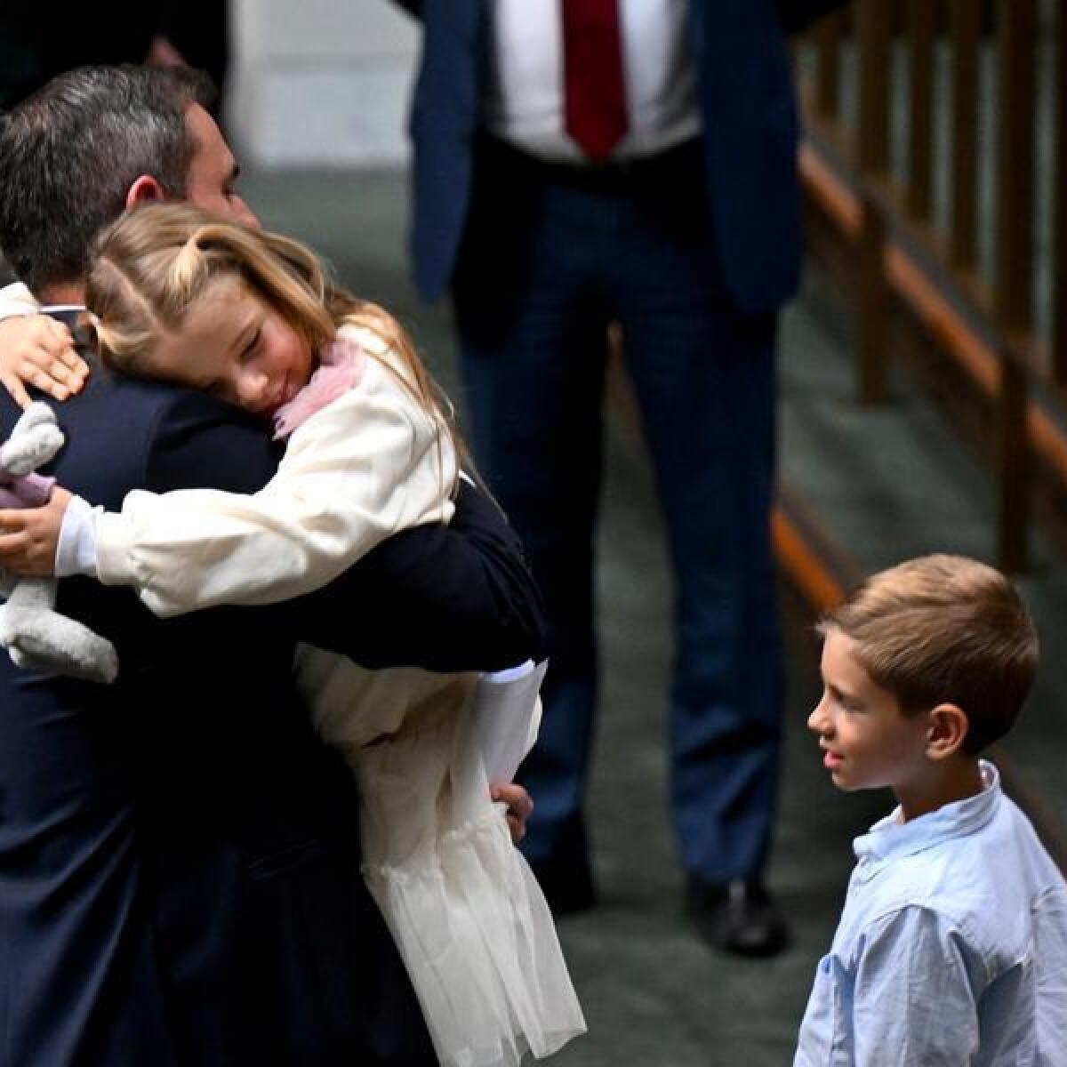 Jim Chalmers hugs his daughter