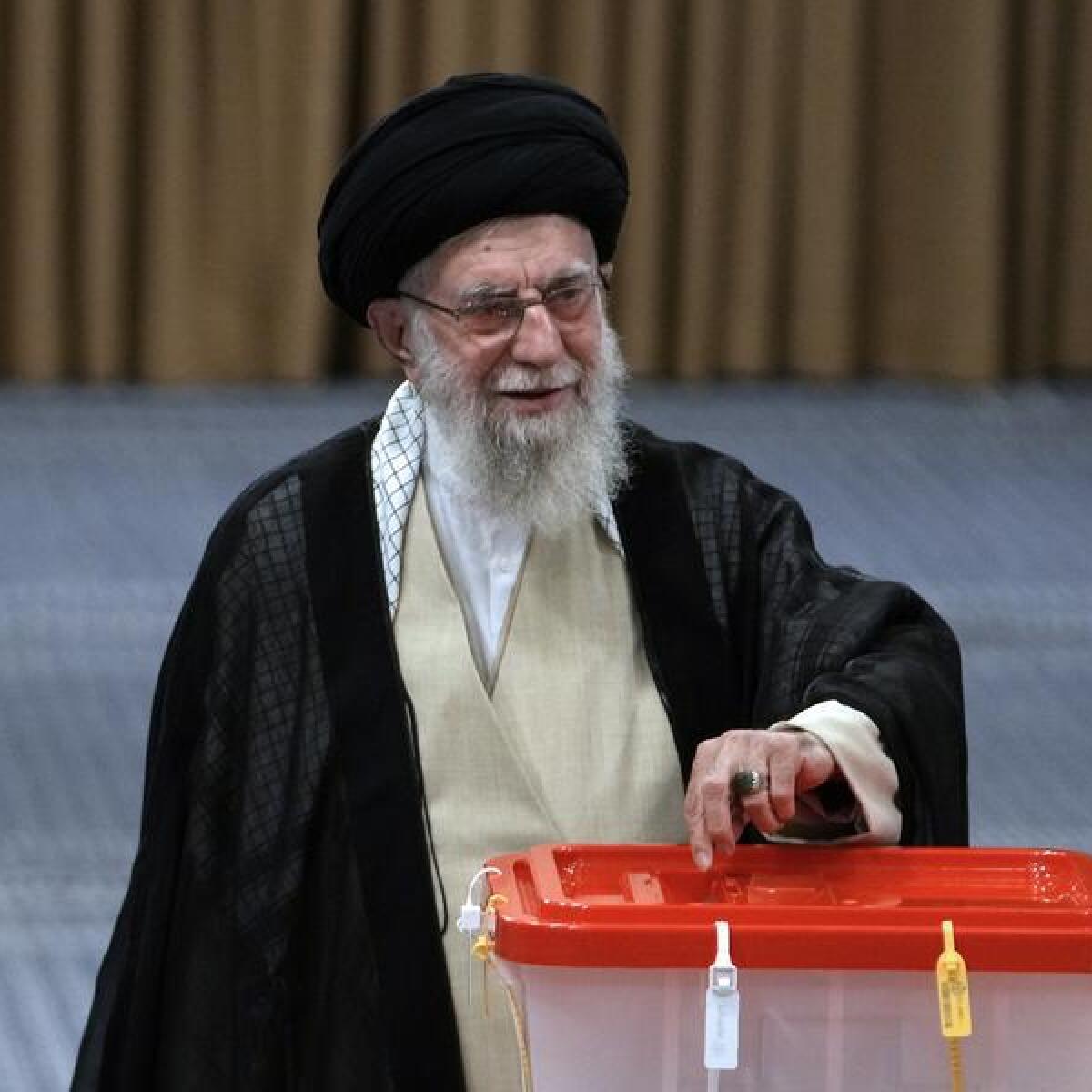 Iranian Supreme Leader Ali Khamenei casts his vote in Tehran