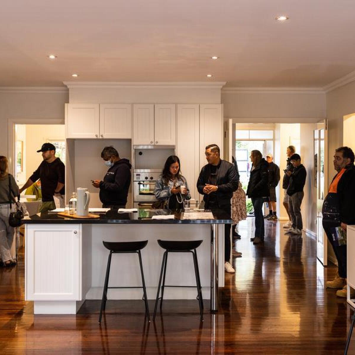 Bidders inside a home during an auction at Glen Iris in Melbourne